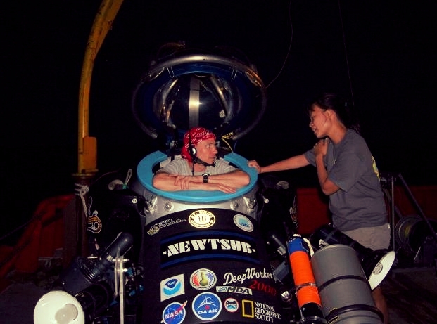 Briefing astronaut Stan Love before his night dive in the Deepworker sub.  