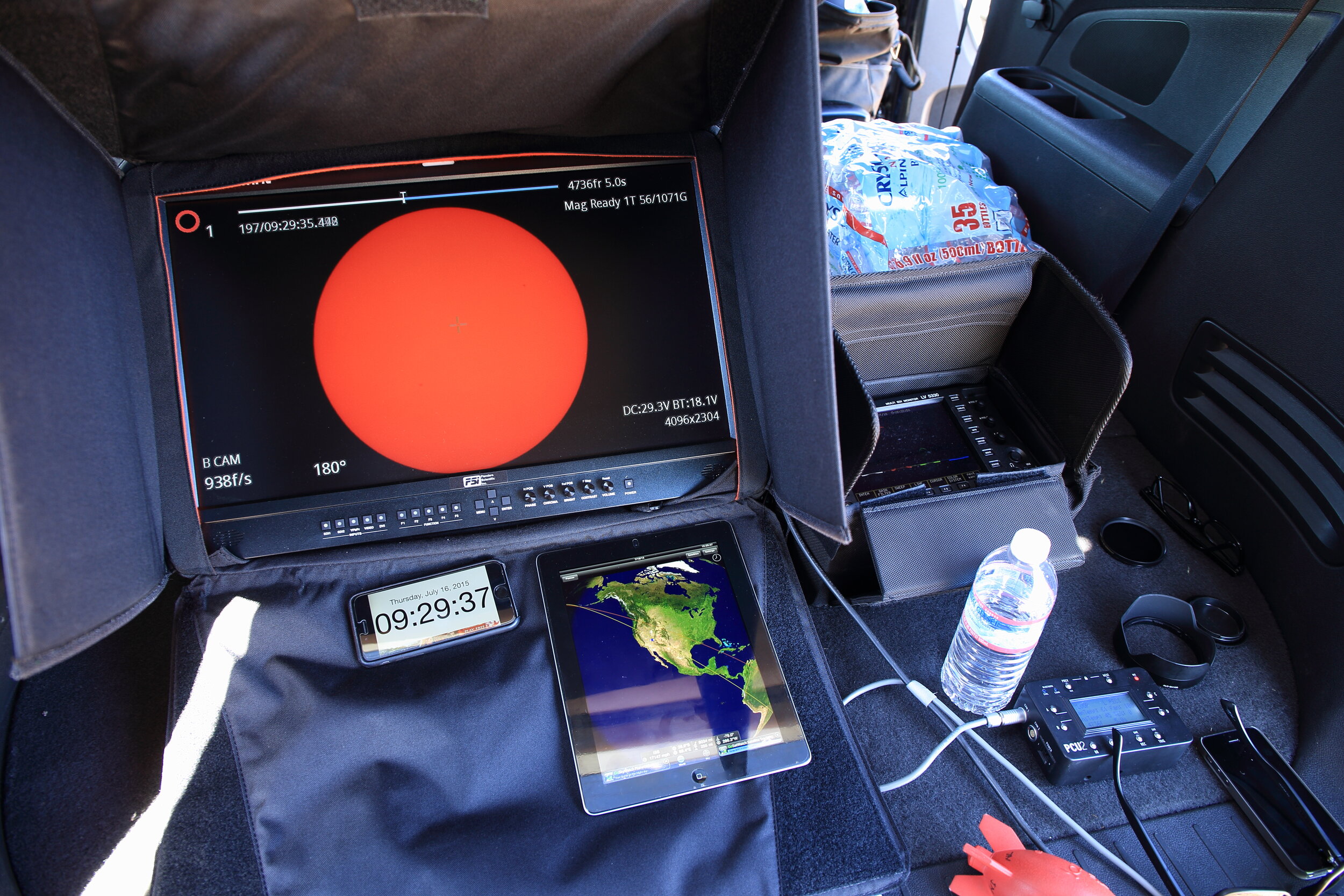 Here is my "command center" for a high-speed sun crossing video shoot I did for the IMAX space film A Beautiful Planet. Below the big monitor you see my iPhone running ClockZ, and my iPad running another helpful app called GoISSWatch.
