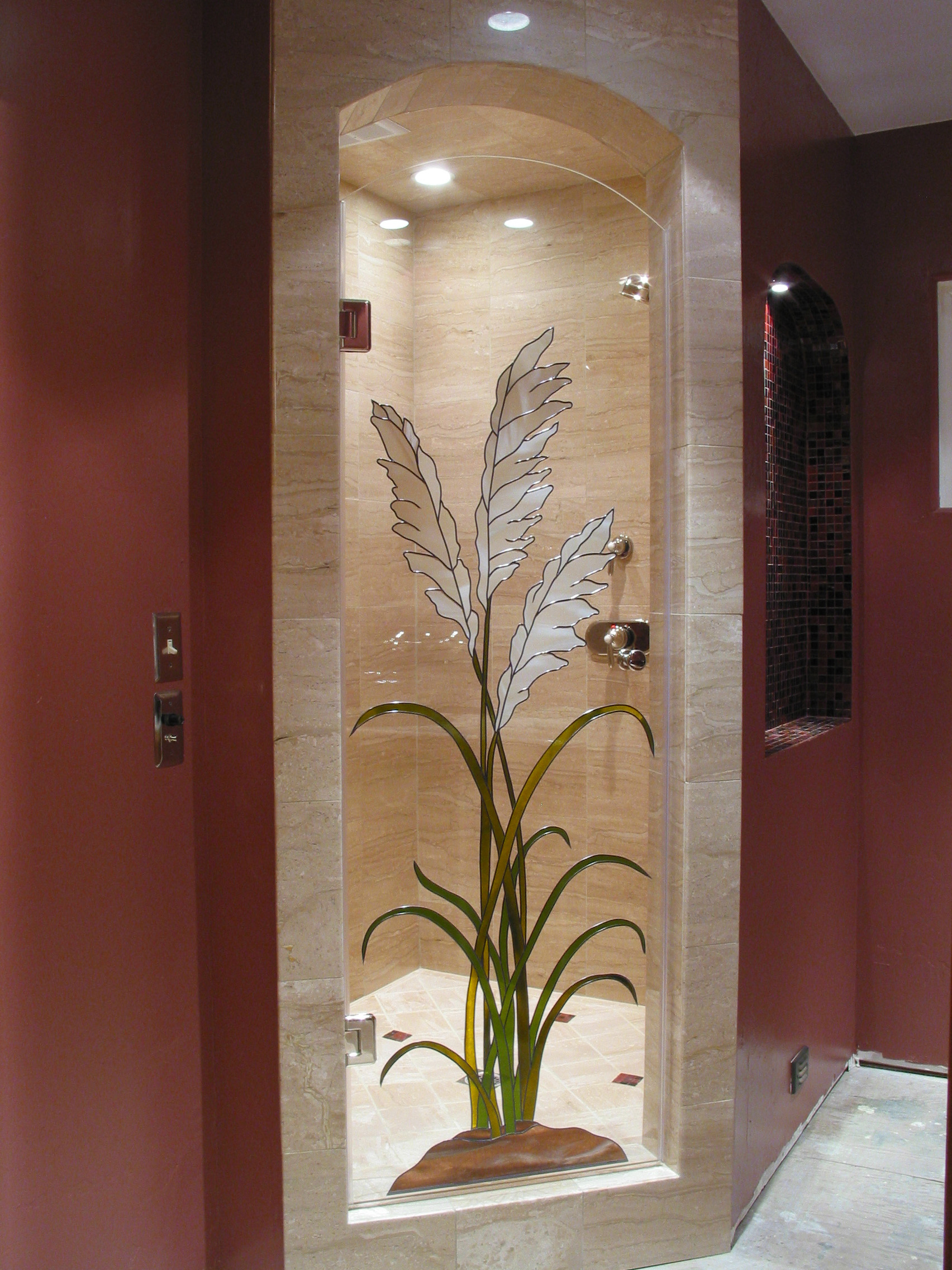 Shower door with tall white plant design