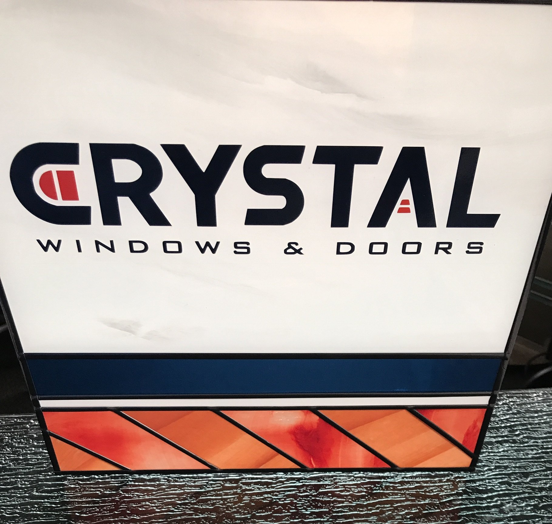  Square panel with company logo Crystal Windows &amp; Doors with company colors, oranges and reds 