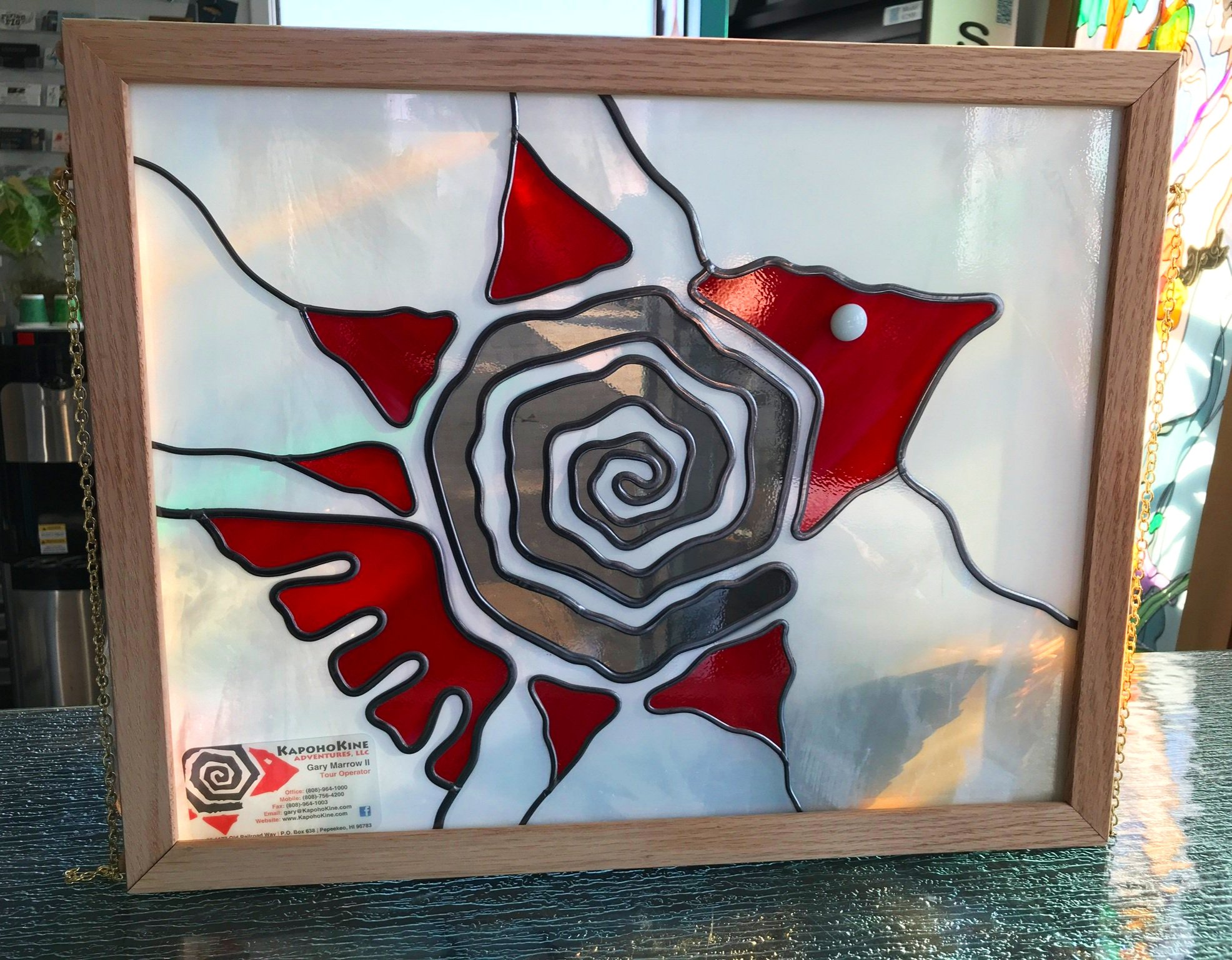  Company stylized fish logo on a square piece of tempered glass 