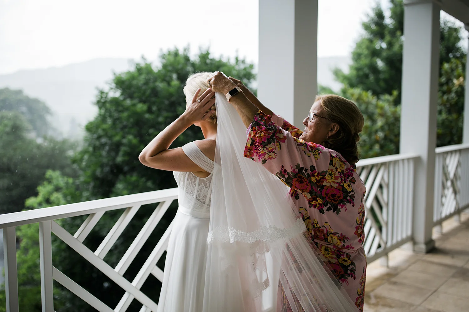 Jessica's mom helps her get ready at the Greenbrier in White Sulphur Springs, WV. The house that they rented to get ready in had this gorgeous balcony outside the bedroom and we were able to use it for a lot of her bridal portraits, first look, getting ready shots and details. 