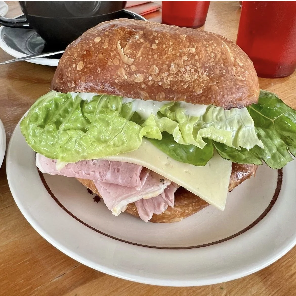 Ham, swiss cheese, piccalilli & cos on specialty bun.