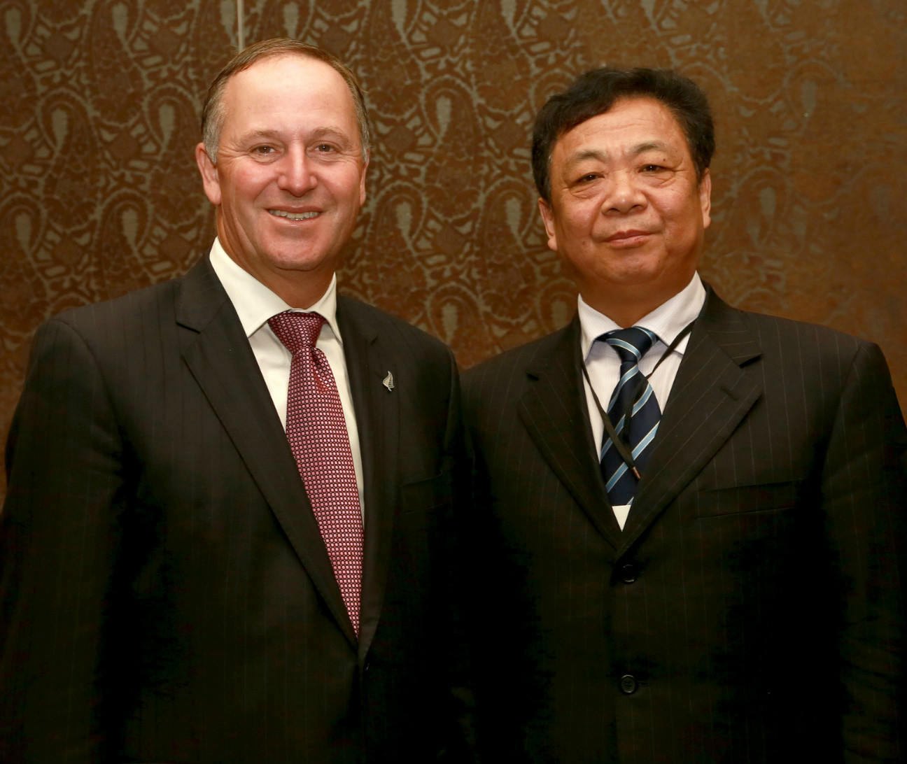 New Zealand Prime Minister John Key and JJY Chairman Wang Peihuan during APEC 2014. 