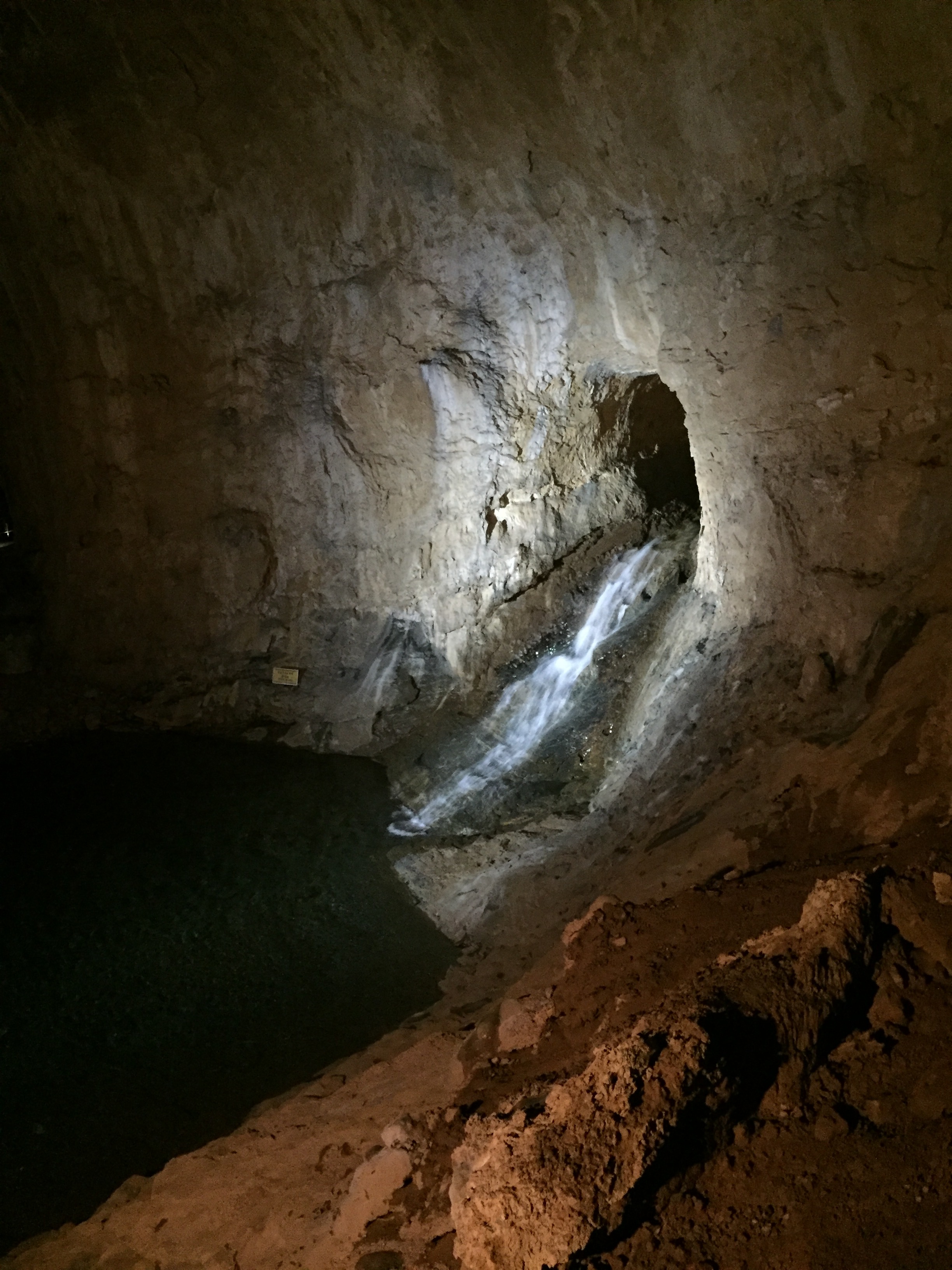A waterfall from the stream that is pumped through the cave. It might have been natural at one time.
