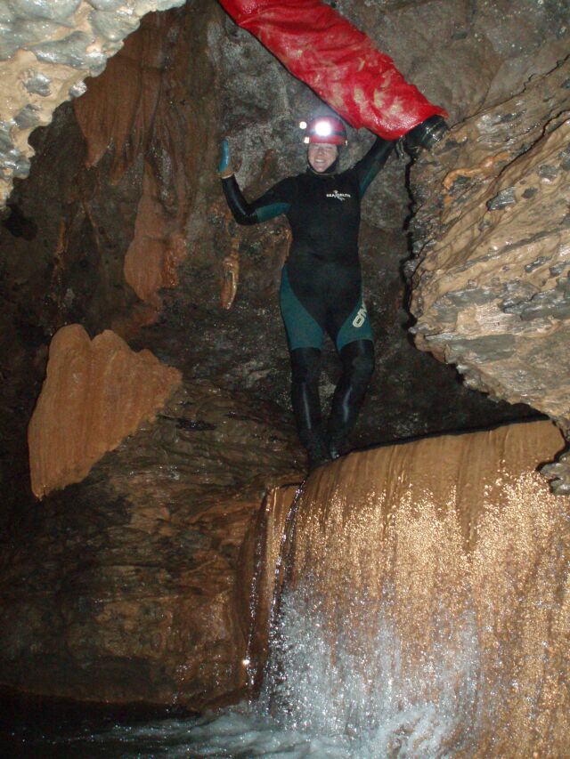 Chrissy standing on the plunge pool- a climb-up from deep water is required to pass this.