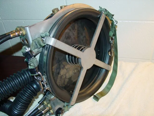 The retaining plate that replaced the original plastic plate.