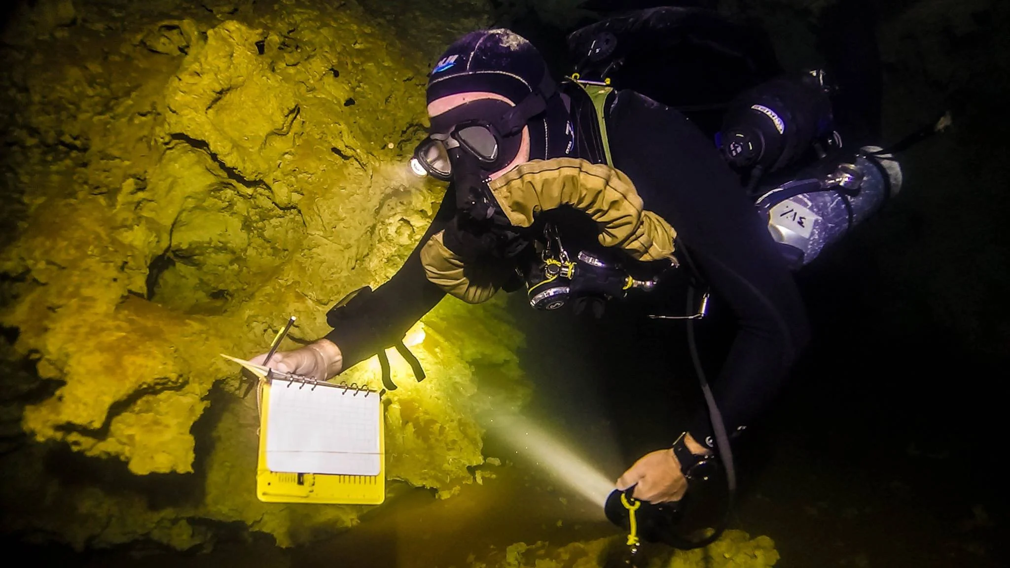 Surveying in Giant Cave, Belize on the sidewinder. Hoses routed under the shoulder.