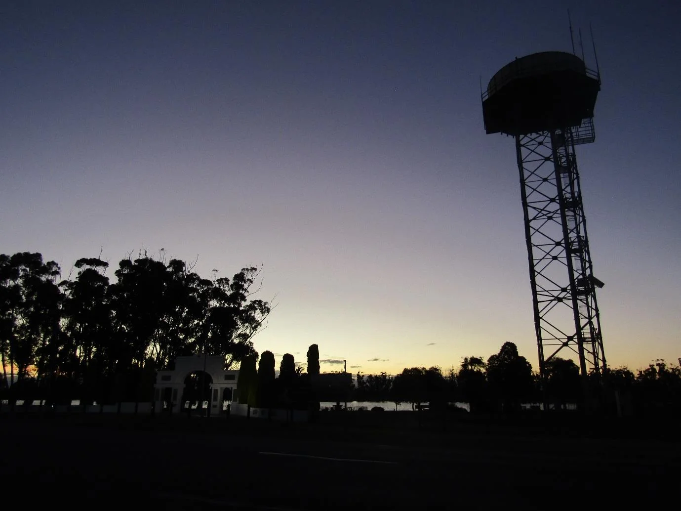 Silhouette of Lake Marma and Water Tower at Sunset