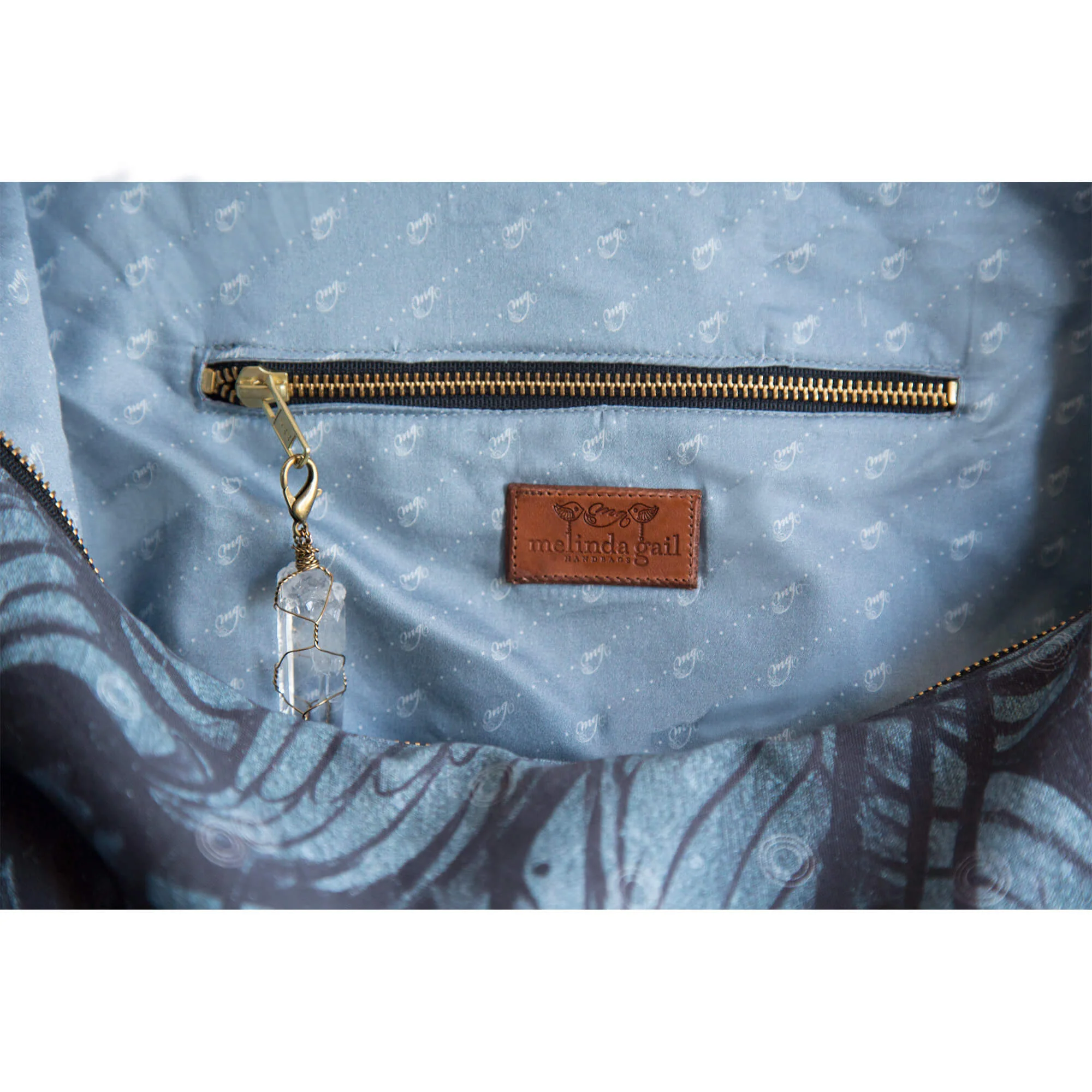 Haniel hobo - Winged print - interior zipper with clear quartz crystal charm