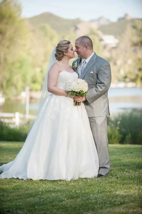 Clean Bridal Updo Swept Back.jpg