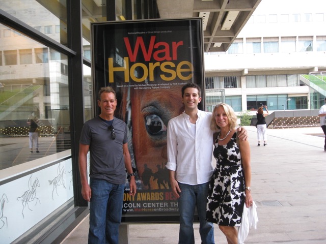 Beth with her husband and son Ben (in white) in front or War Horse billboard at Lincoln Center in NYC. Ben acted in the show for 1.5 years