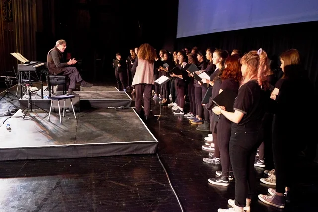 Valérie and the SFGC sing for Philip Glass last Fall after his sound check at the Paramount Theater in Oakland