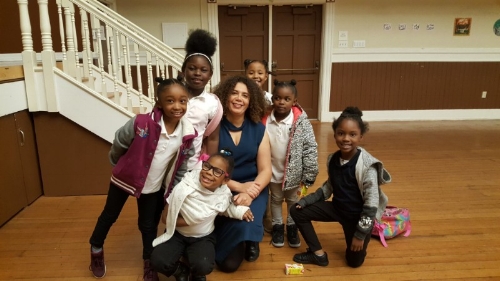Valérie with several choristers from Dr. Charles R. Drew College Preparatory Academy after class at Bayview Opera House