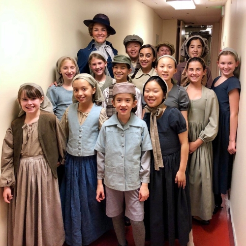 SFGC choristers in costume with alumna Silvie Jensen before opening night of Pagliacci at SF Opera!