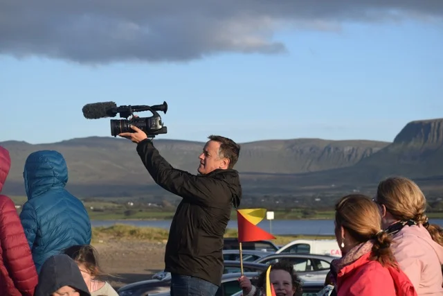 Micheál recording the event video at the Twilight Parade