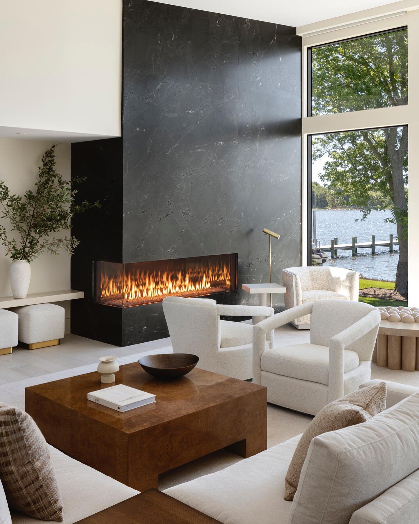 Sit next to a cozy fireplace on this cold fall day. #moderndesign #contemporaryarchitecture