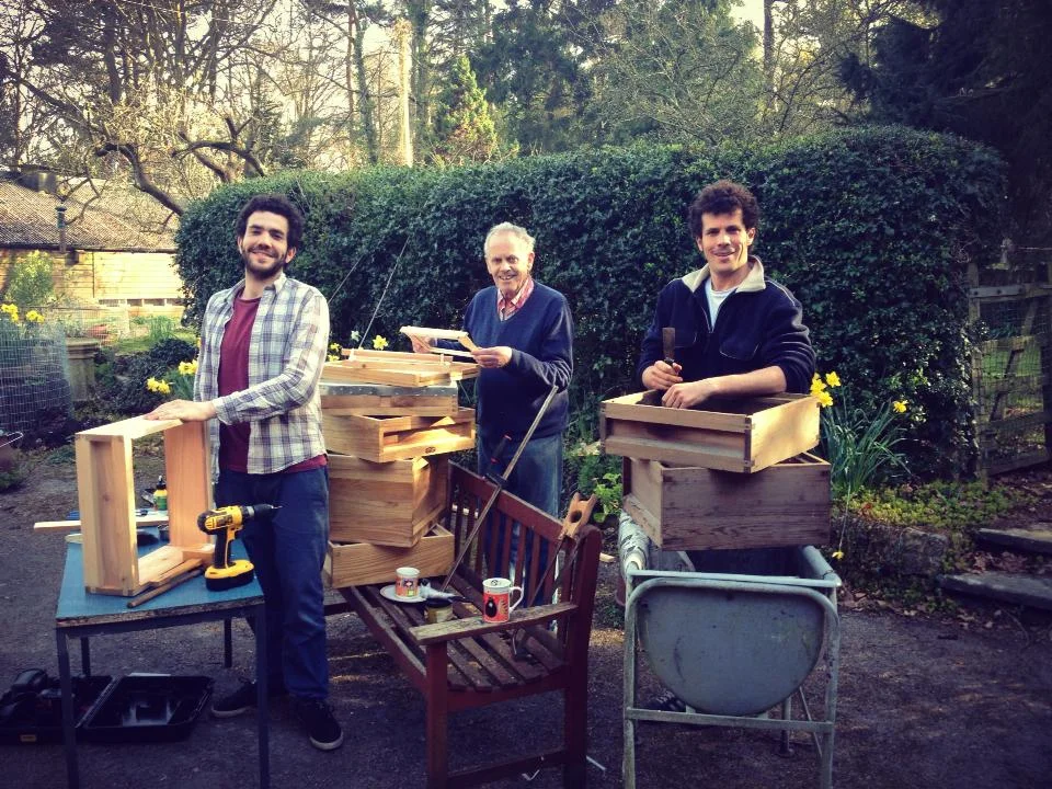 Knocking up a beehive. Tom Noble, Deryk Noble and Simon Noble.