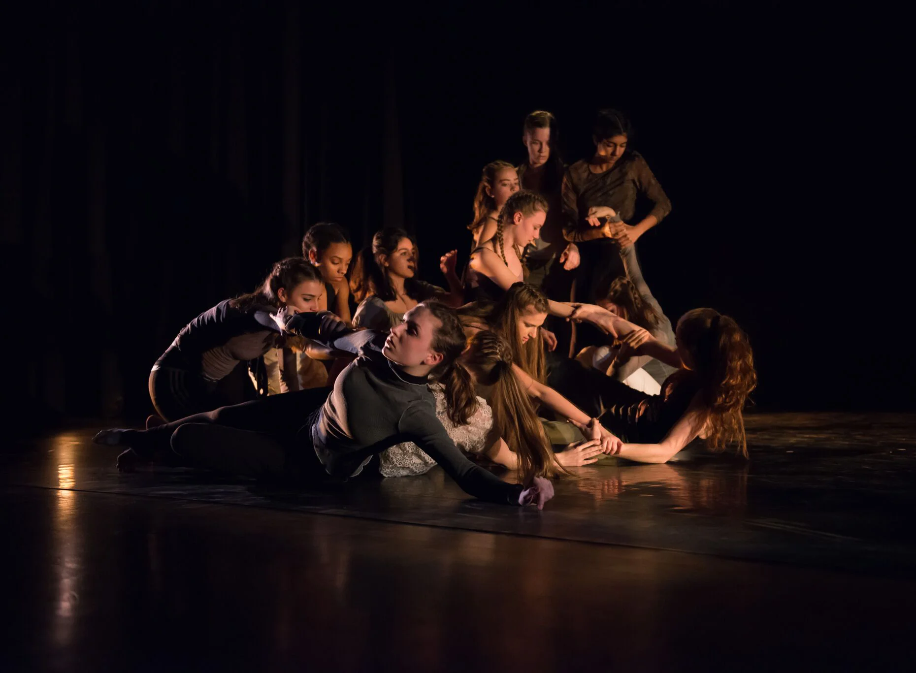 The cast onstage frozen in a tableau