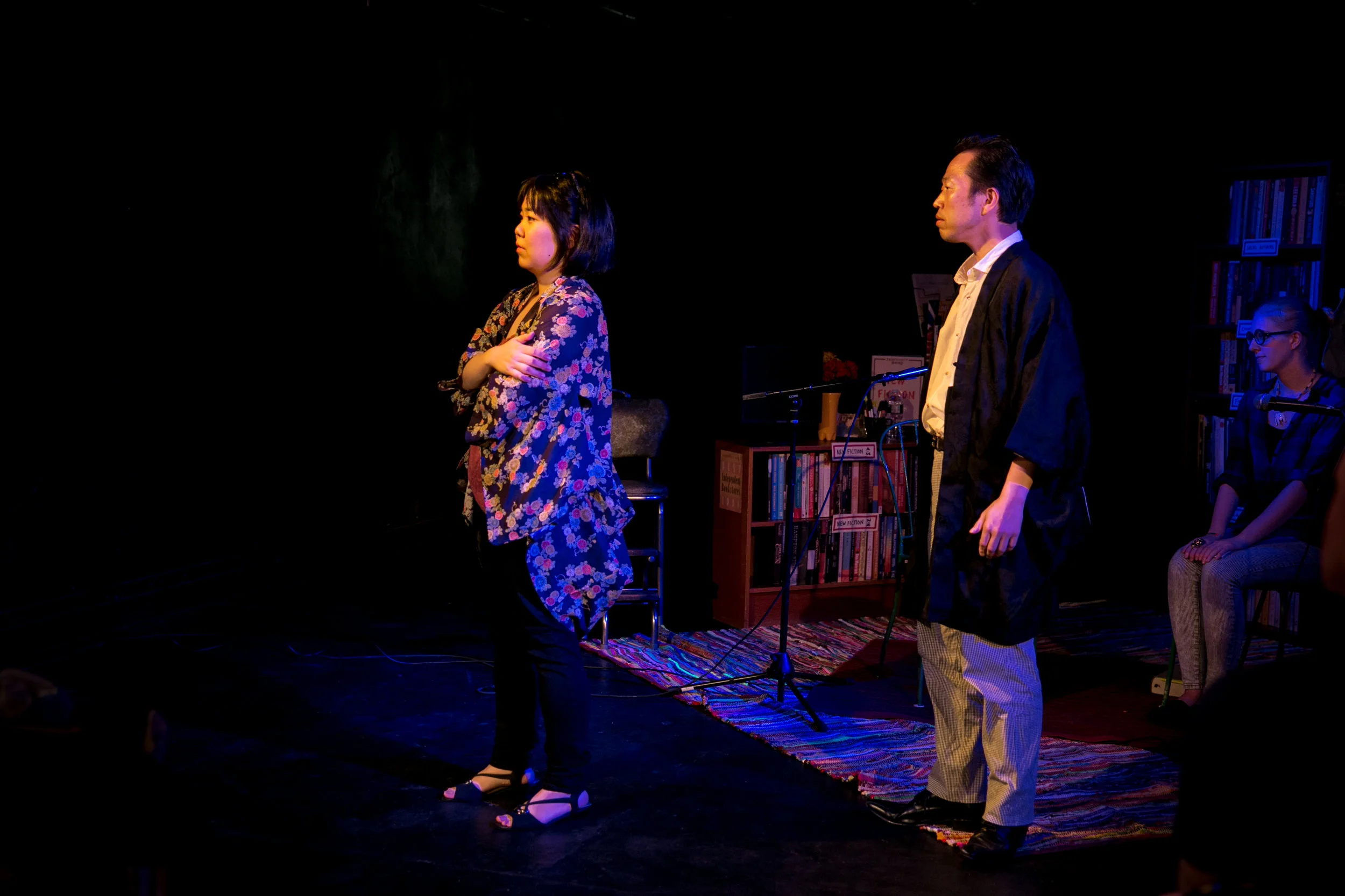 Murasaki looks off with arms crossed, Genji looks at her