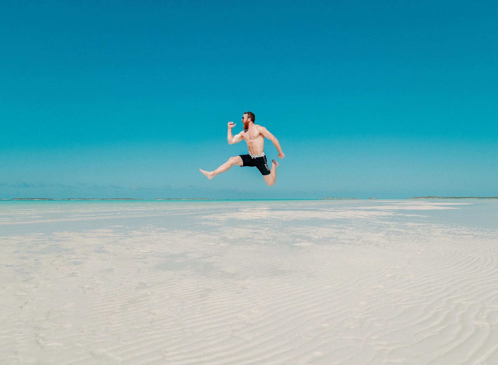man-jumping-on-the-beach-to-boost-self-esteem.jpg
