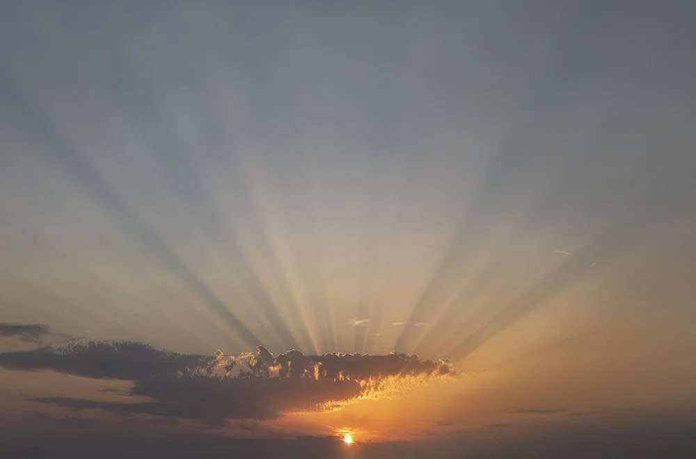 Sunset, beams of light  Available to own as a  print  or  postcard