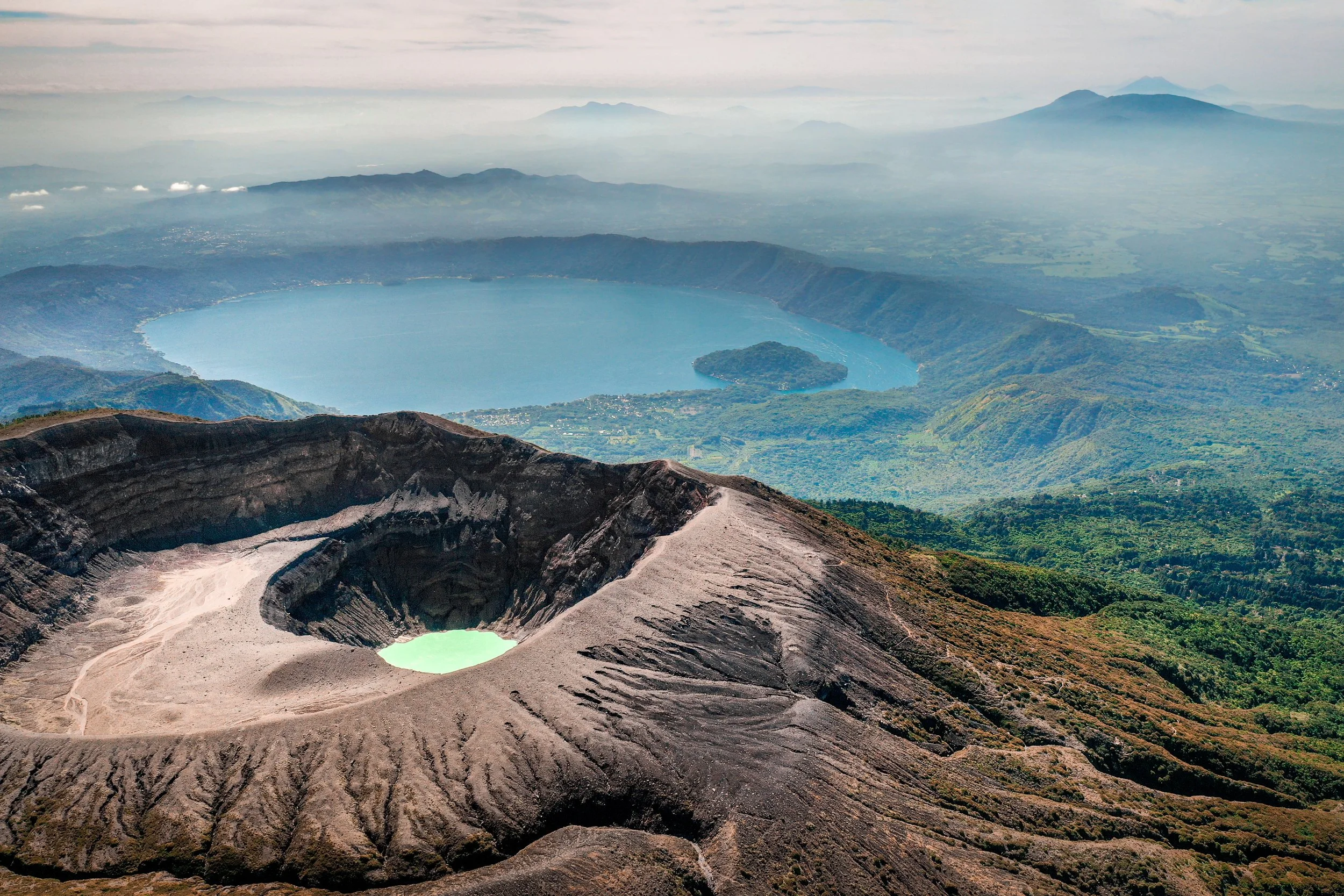 Aerial view of Santa Ana Volcano with lake and mountain cloud backdrop.jpeg