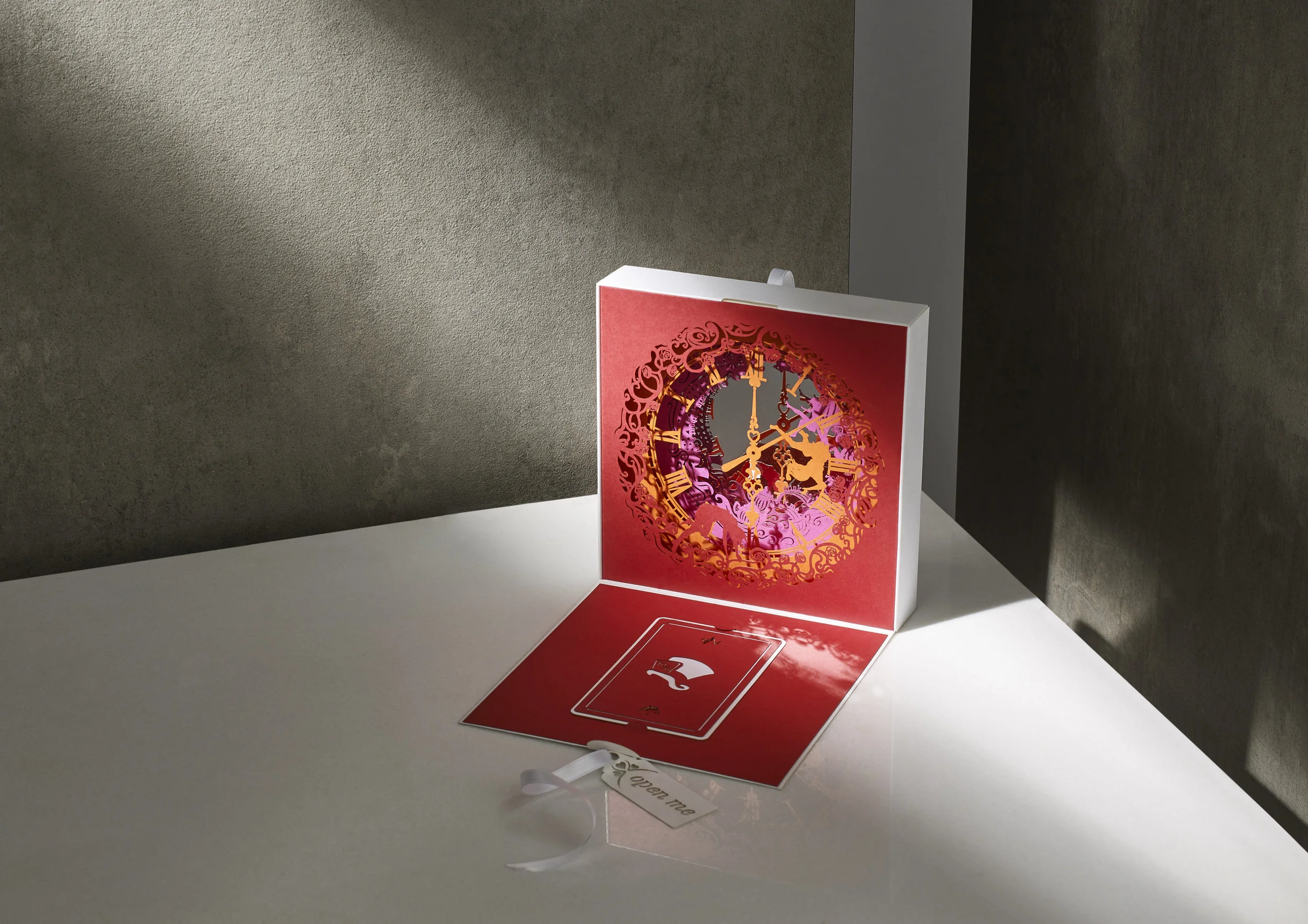 bespoke children's party invitation laser cut with alice in wonderland inspired illustrations and quotes, all hand assembled