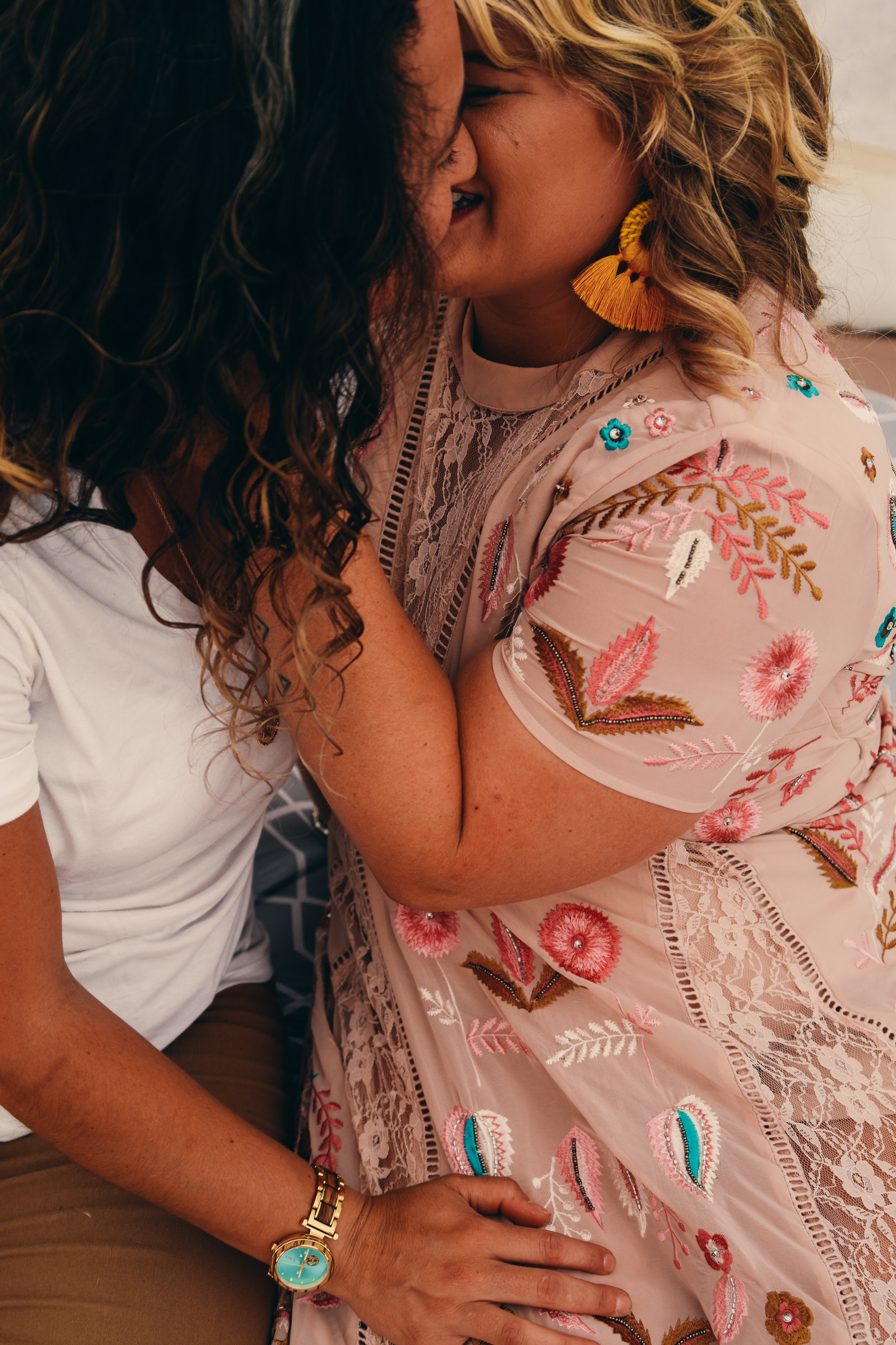  An LGBTQ+ couple lean in for a kiss at their elopement 