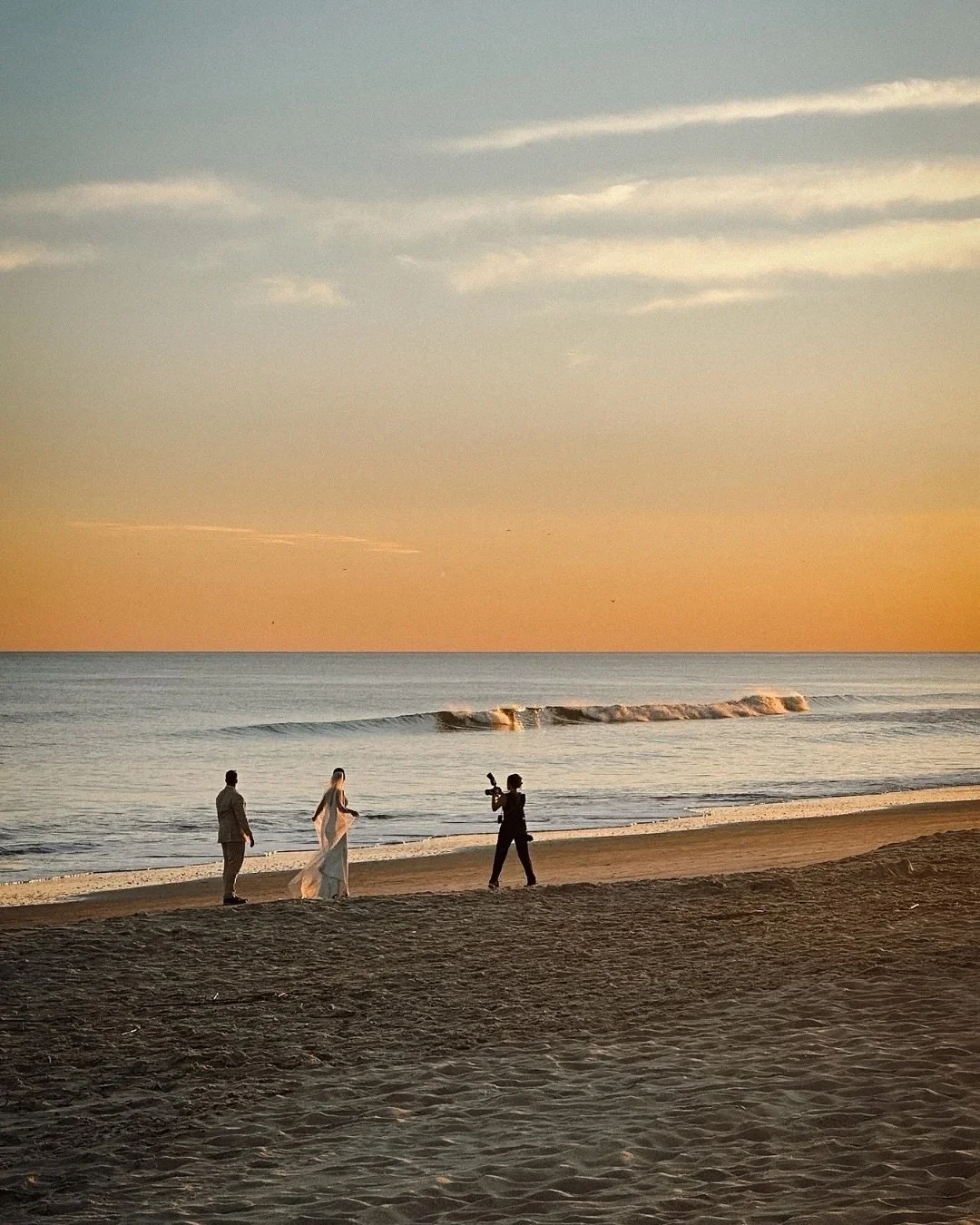 It&rsquo;s rare that I get a photo of myself photographing a couple from a completely different angle. This first image is what you might see as a wedding guest, and the next few are what I see during those golden hour moments and all the other speci