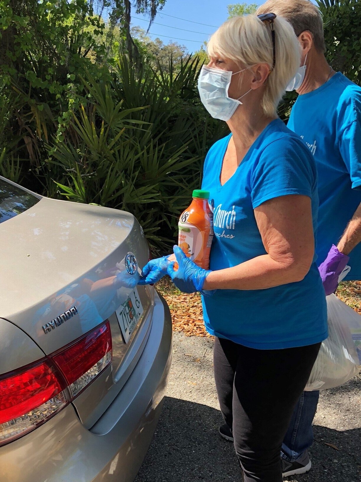 BEAM volunteers load groceries into the trunk of a car during a BEAM Mobile Food Drive in Mayport. BEAM is now offering “drive-thru” style pick-up from Mobile Pantries to ensure the safety of clients and volunteers during the COVID-19 Pandemic.