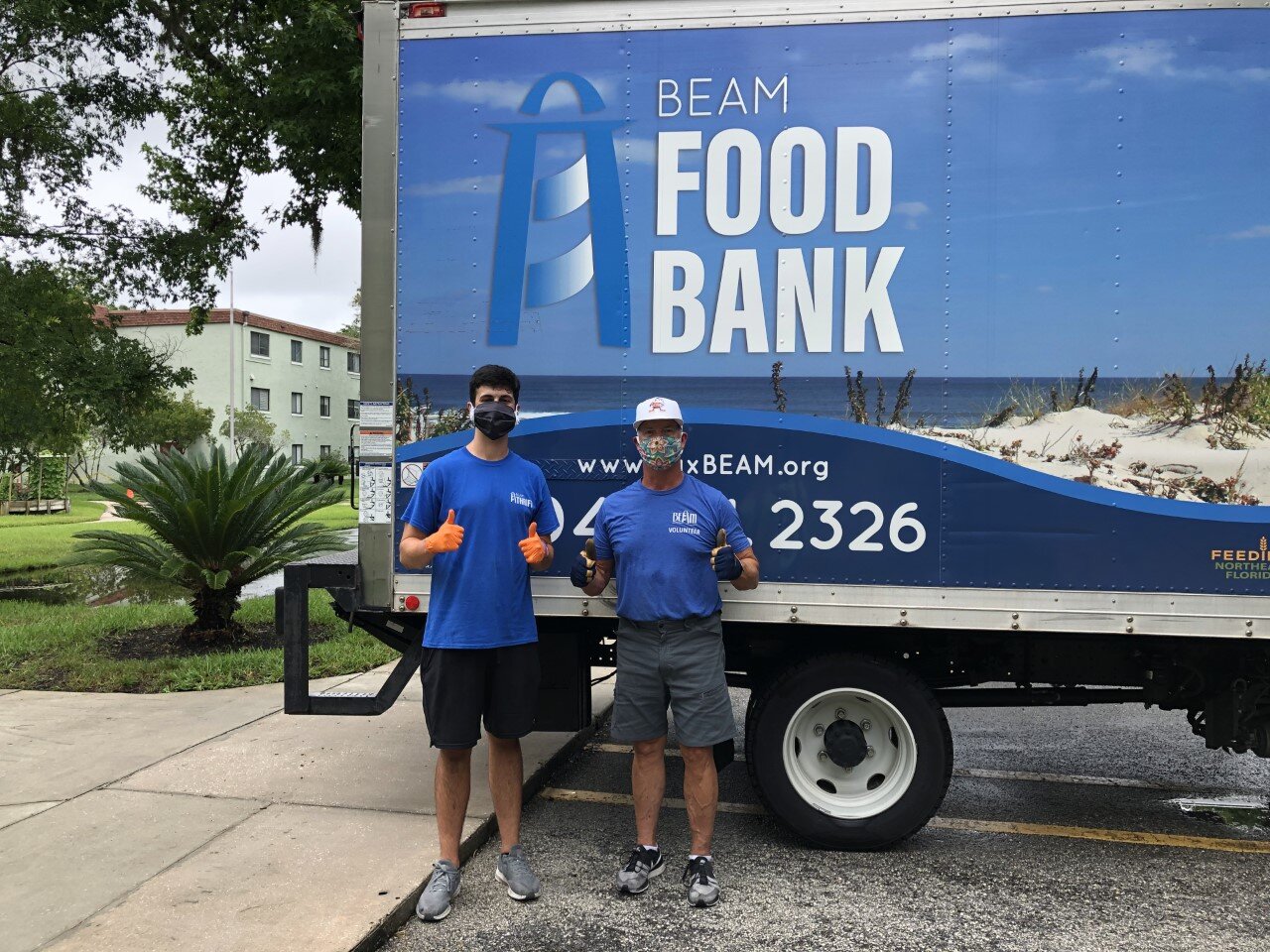 Connor and BEAM Volunteer Geoff, feeling good after their delivery of 1,200 pounds of fresh groceries to Pablo Hamlet senior residents.