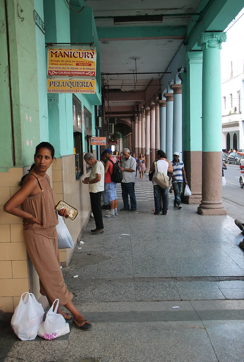 Photographer's Note: When I think of Cuba, three things come to mind: its white sand beaches, water so clear it looks as if it could be straight from a beer advertisement—its streets, peppered with houses every shade of the rainbow—its humor from th…
