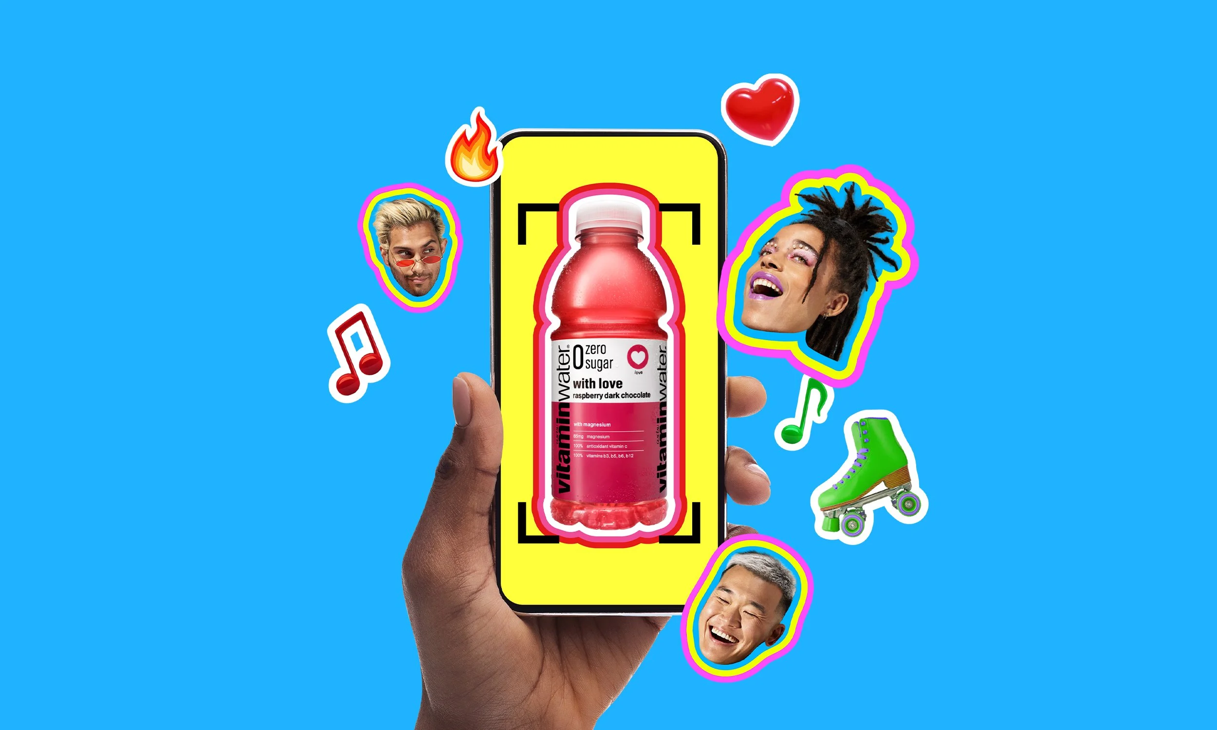 A person holding a smartphone displays a pink raspberry dark chocolate flavored Vitamin Water bottle with a yellow background. Around the phone are colorful stickers of people smiling, a roller skate, hearts, musical notes, a fire emoji, and vibrant outlines, set against a bright blue background.