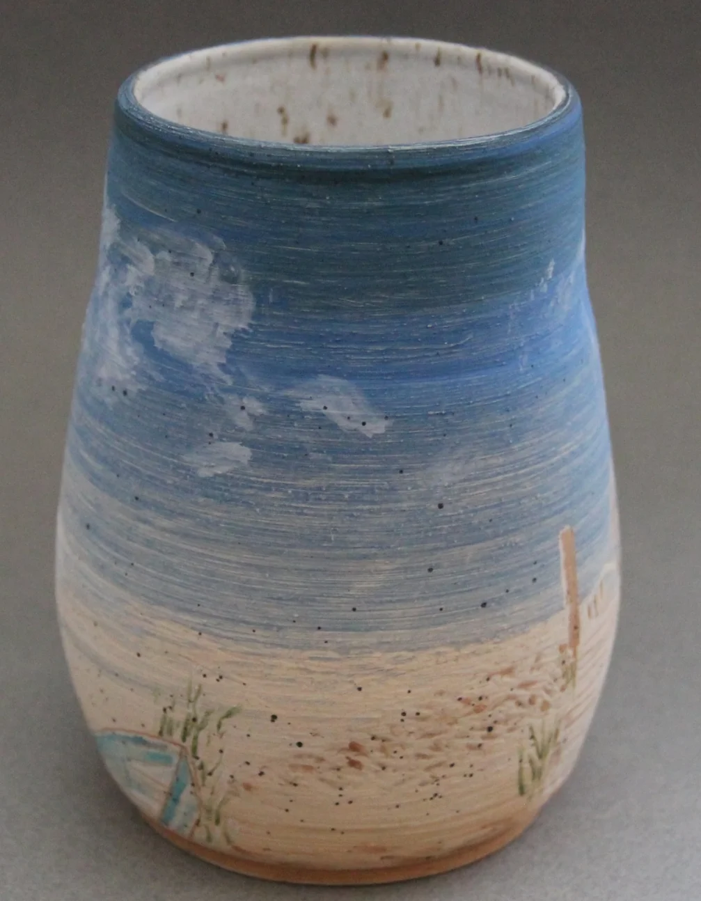 Scenes in slip carving and underglaze painting
