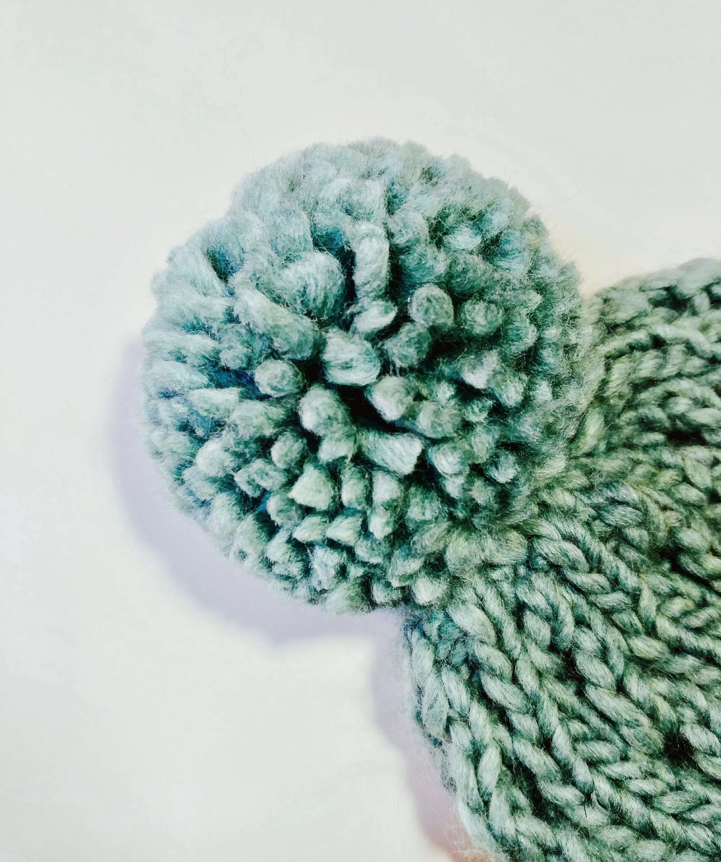 Try making your pom with yarn in a contrasting color!