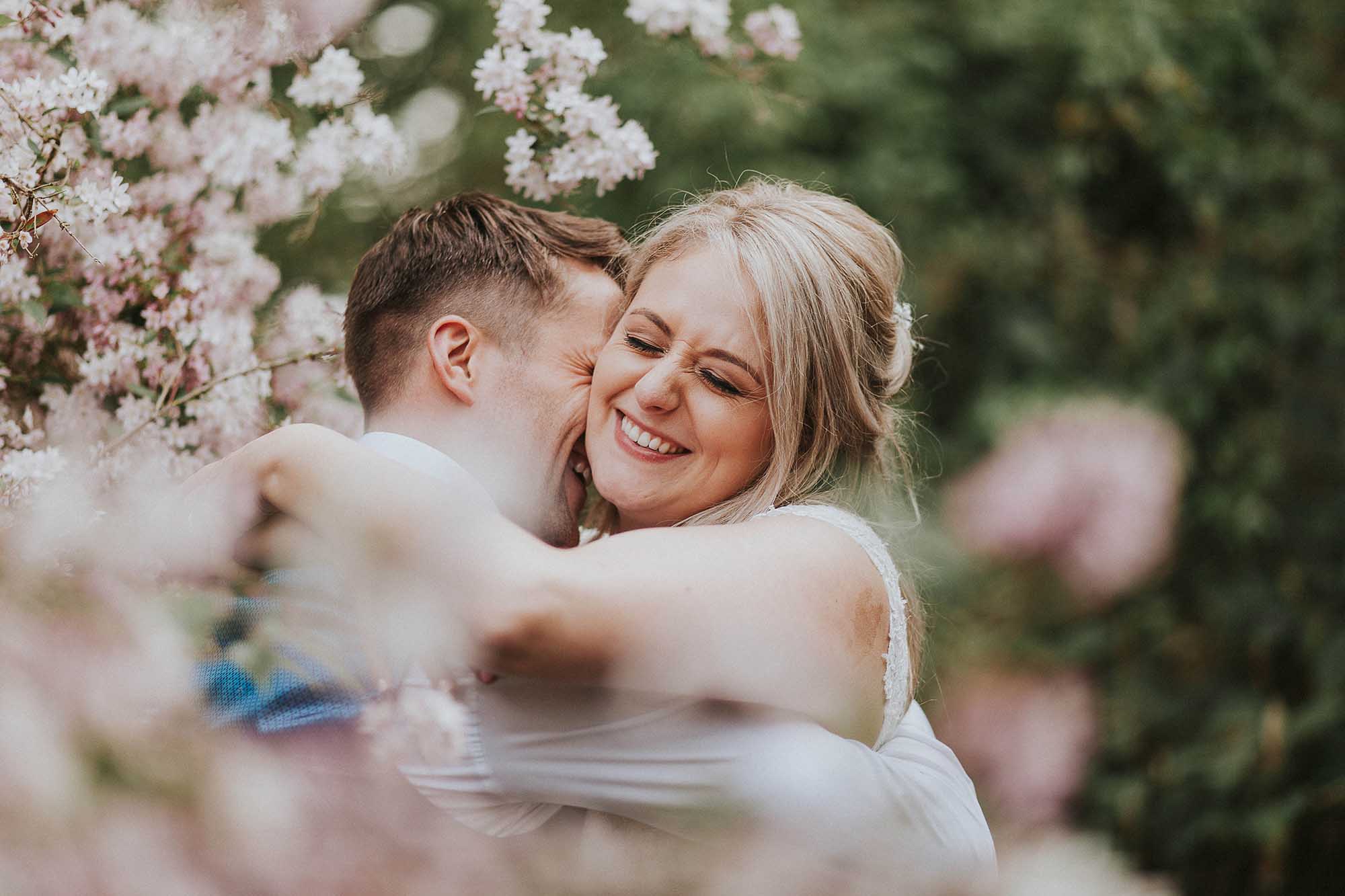 bride and groom in the gardens at East Riddlesden Hall