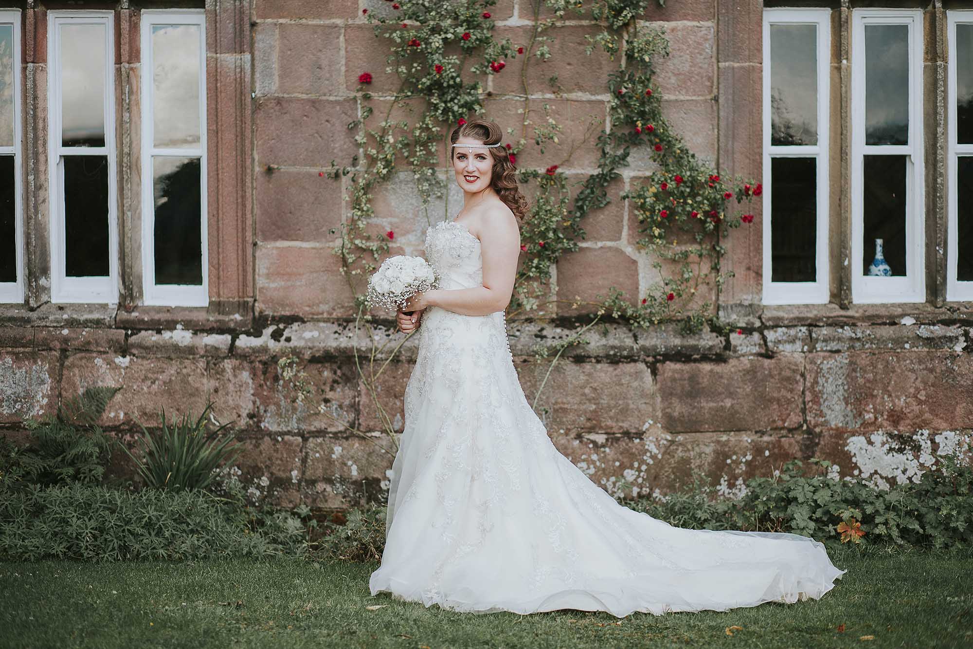 Bride outside Browsholme Hall and Tithe Barn