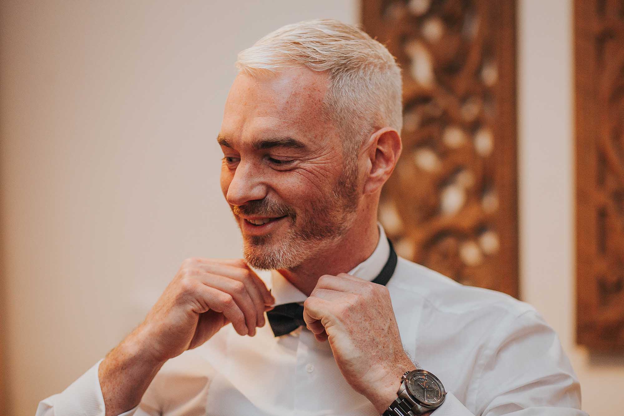 Groom getting ready at Great John Street Hotel