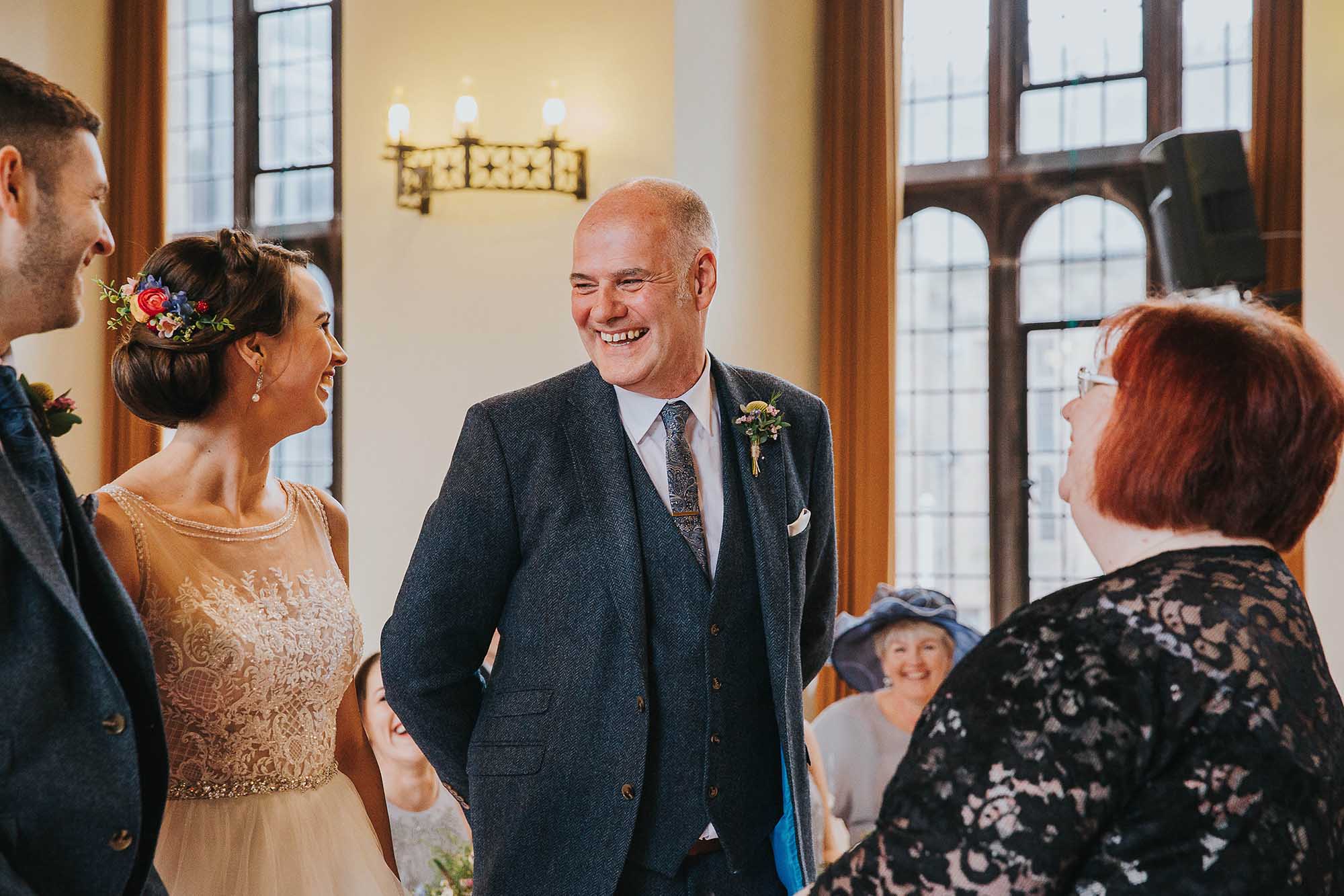 father of the bride during wedding ceremony at Bolton School