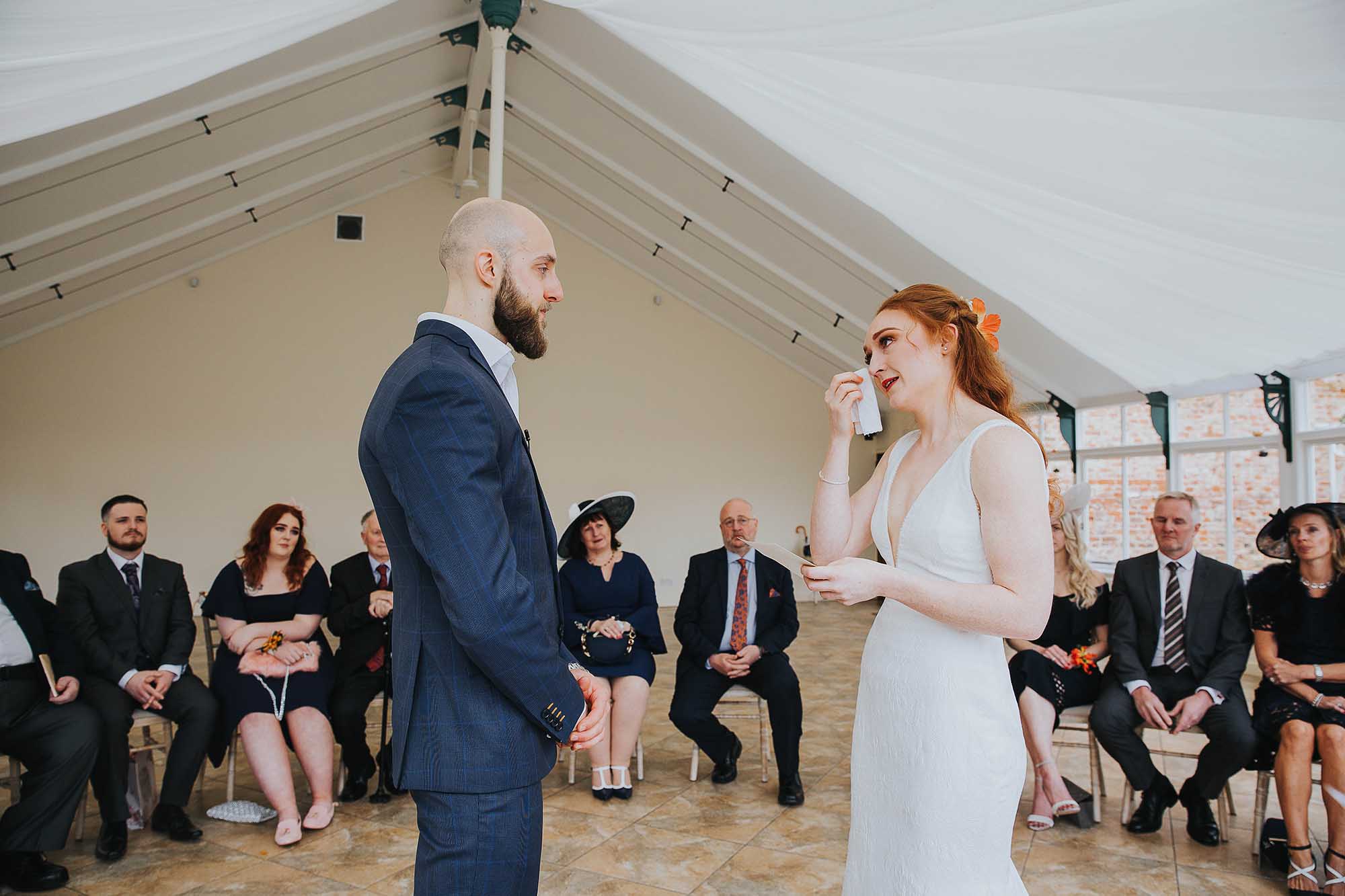 Combermere Abbey wedding ceremony in the glasshouse