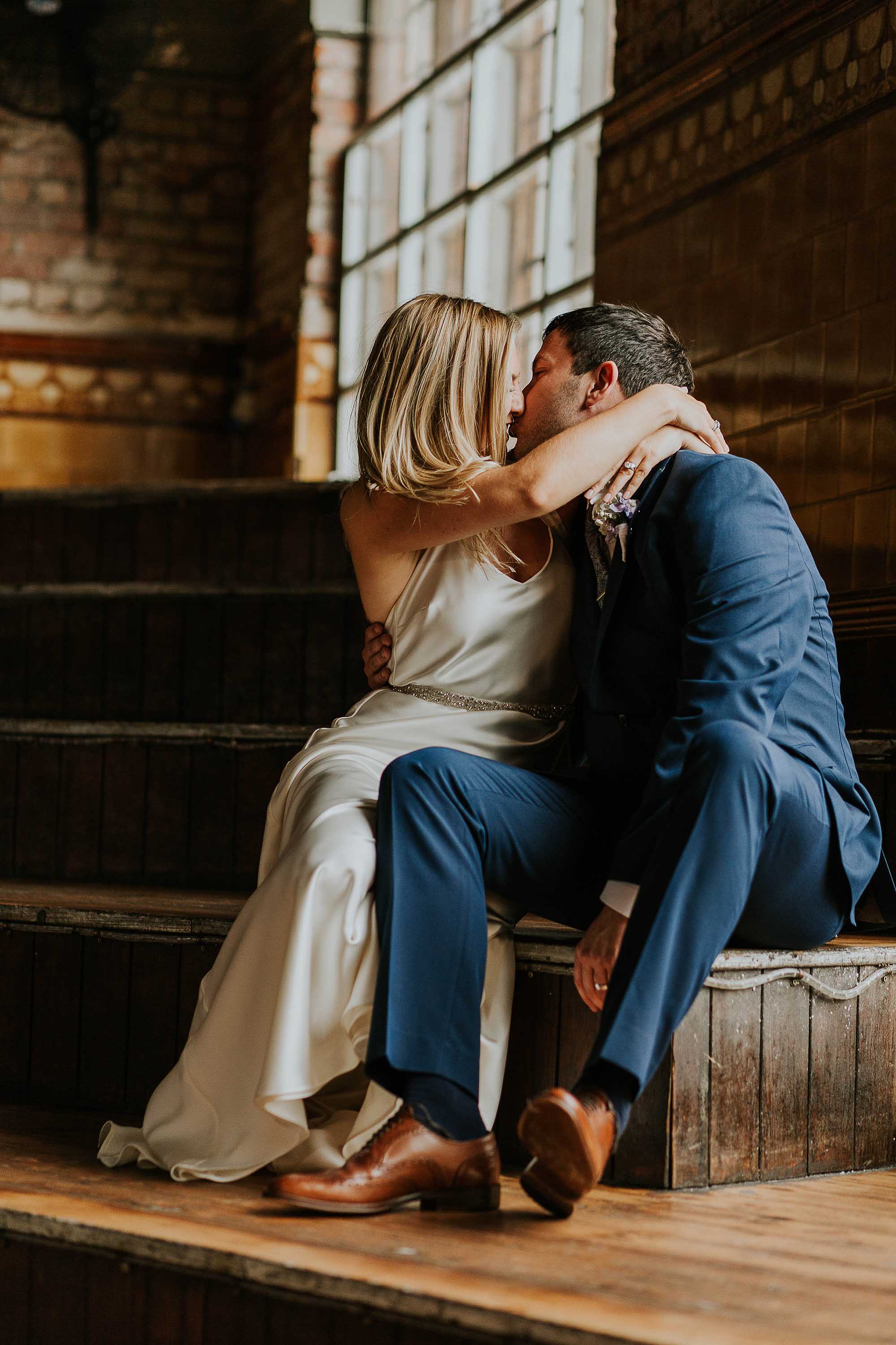 couple's wedding portraits inside the Albert Hall Manchester