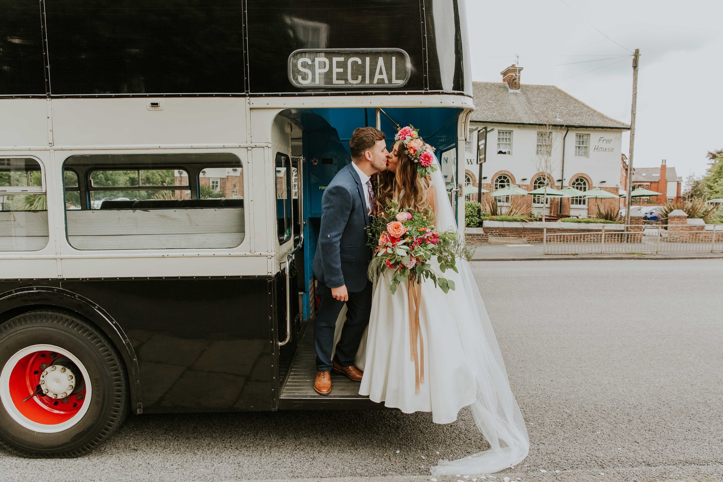 Bride and groom on vintage bus in Leeds