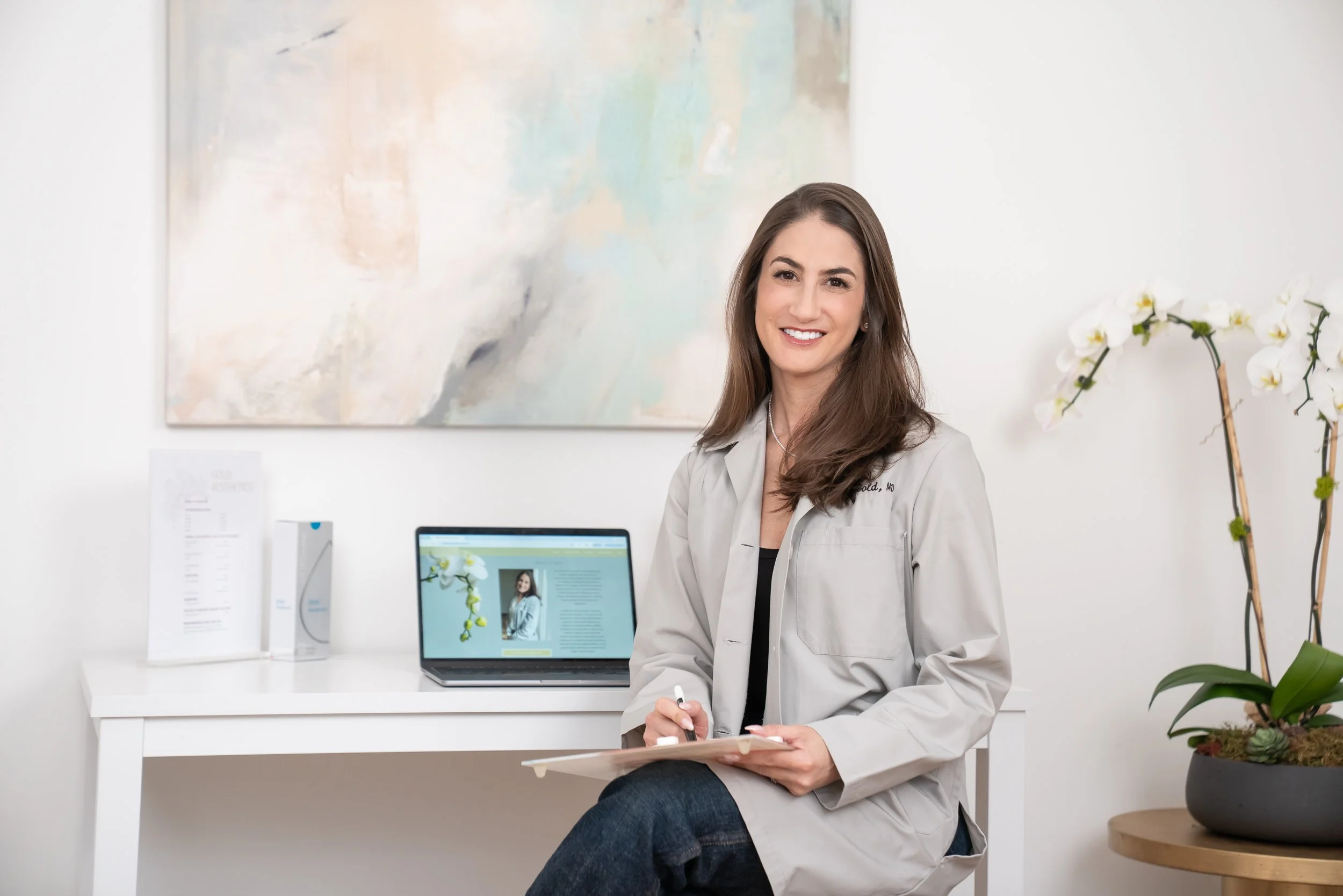 female physician seated in her home office