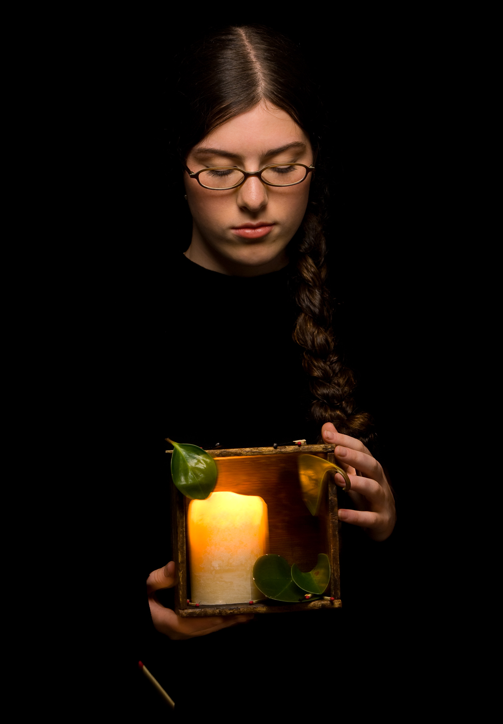 The leaves in my box represent life; how everything is always growing. The candle in my box also represents life, but in a different way. The candle flame represents a single human's life, and how while it is lit it glows. The flame can be blown out, but, as the matches scattered in my box, show us, there is always something there waiting to re-light our flame and make it glow again. Sarah H. Lawrence, Kansas 2007