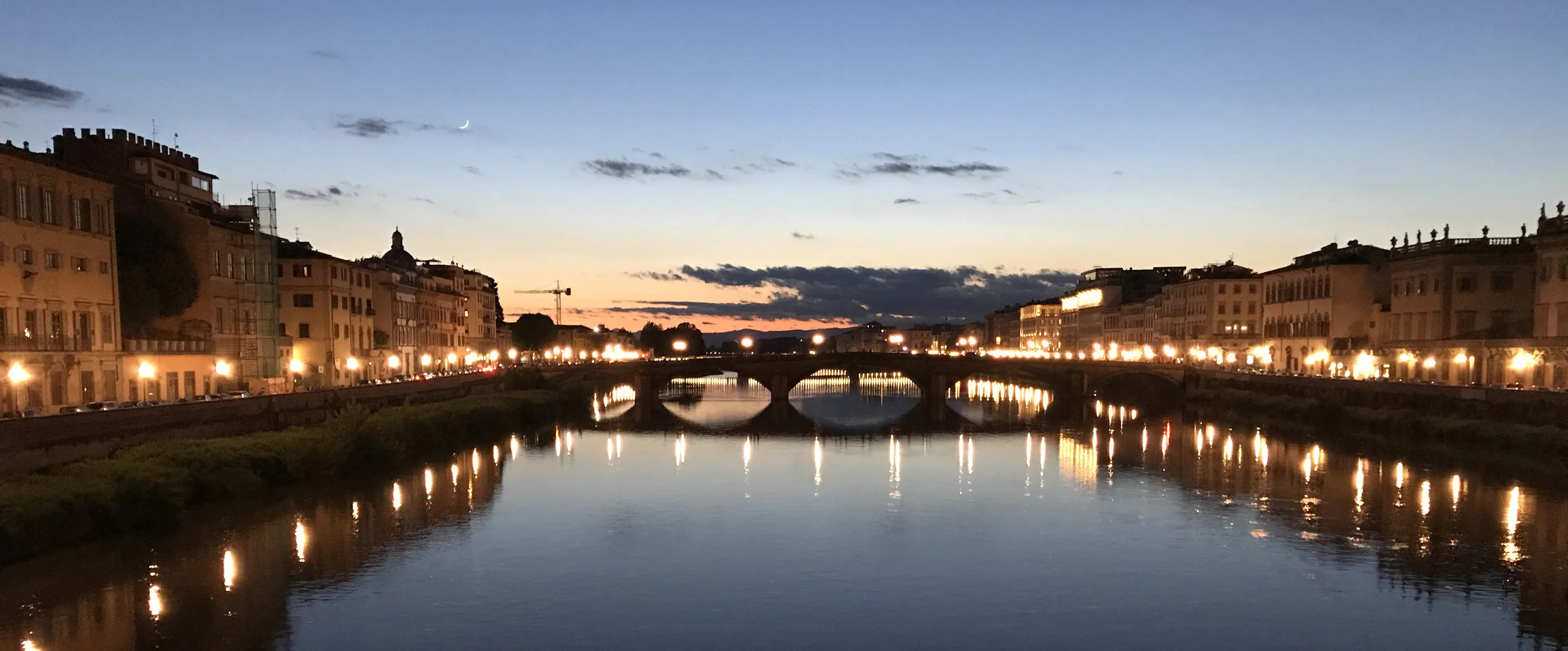 Sundown from one of the bridges crossing the Arno River in the heart of Florence.