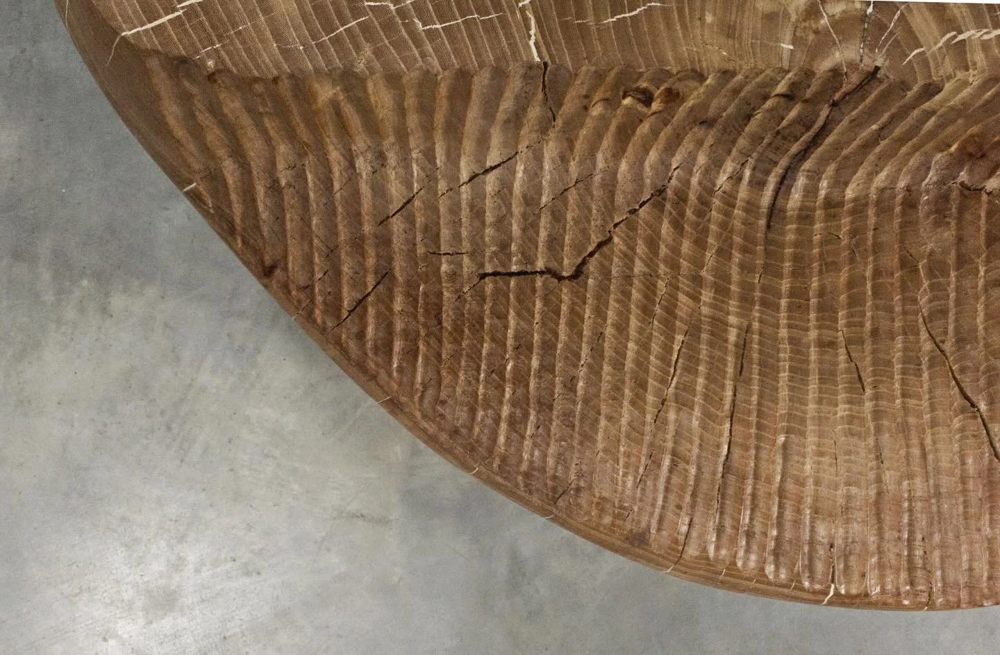 Sculpted Side Table in Elm. Highlight the natural beauty and character of Elm wood. Sized to fit beside your sofa or bed, blending functionality with artistic flair. Or use it as a coffee table. Embrace the elegance of nature in your home with this e