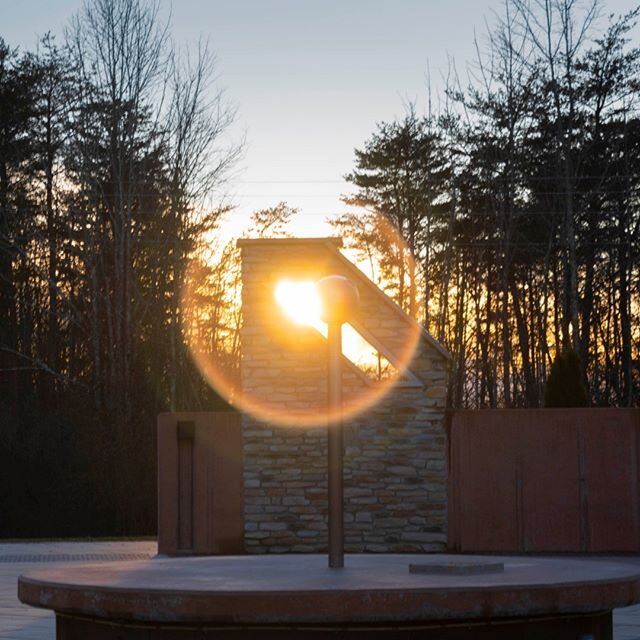 The John Glenn Astronomy Park's plaza features six &quot;sun slots&quot; which capture the rising and setting sun on the first day of every season.  Today, on the first day of winter- the Winter Solstice- the sun set though the gap at the southwest c