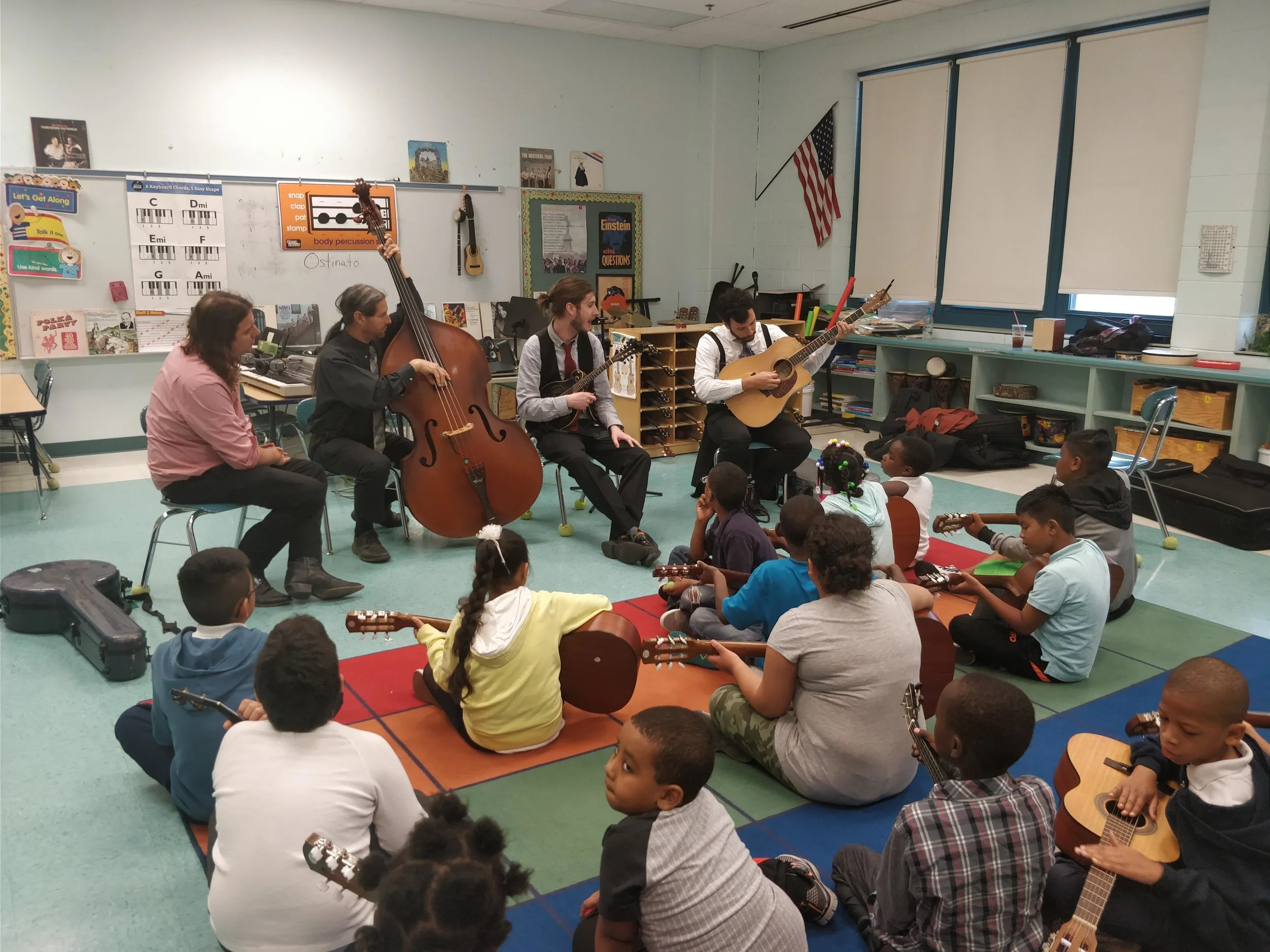Chris teaches the history of the guitar and basic technique to the kids. The questions we got from this group were incredible, ranging from 'does it stop hurting your fingers?' to 'do you still like each other?'.