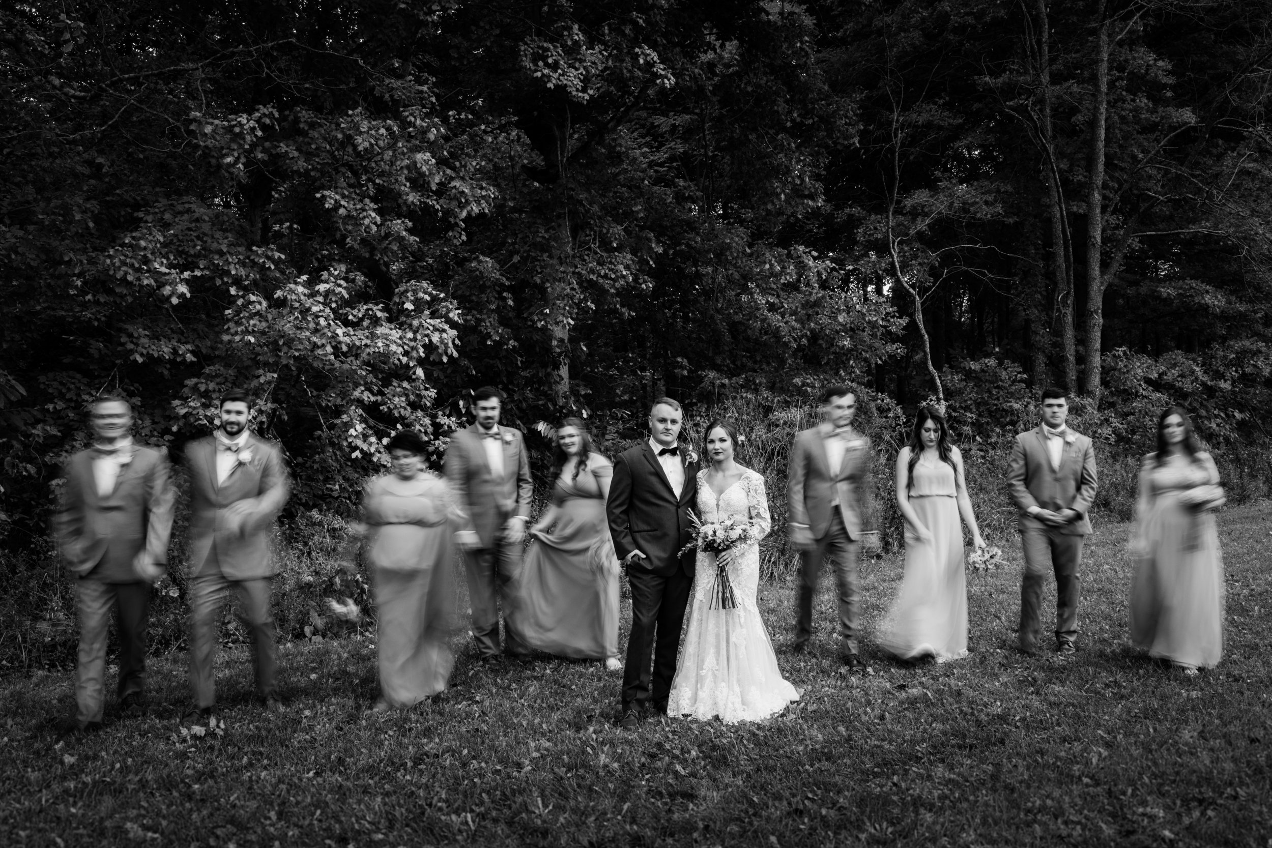 black and white bridal party wedding photography photographer blurred motion barn at hamner ridge indiana.jpg